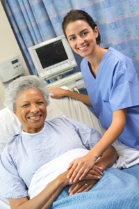 nurse and senior patient smiling at camera 